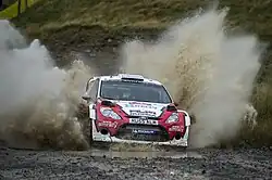Jevgenij Novikov s navigátorm Ilkou Minorem na s vozem Ford Fiesta RS WRC na Velšské rallye 2012