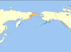 Rozšíření (oranžově hnízdiště, žlutě migrace, modře zimoviště)