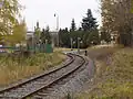 Pohled od železniční stanice ke křížení se silnicí I/45