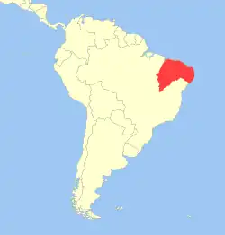 Rozšíření kosmana bělovousého (červeně)