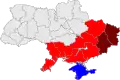 Mapa Ukrajiny vyznačující barevně oblasti jihovýchodu (světle červená), Doněckou a Luhanskou oblast (tmavě červená) a k Rusku se připojivší Krym (modrá)