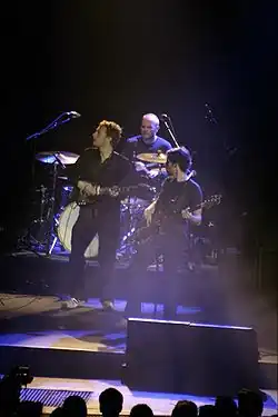 Členové kapely, Chris Martin, Will Champion a Guy Berryman