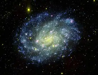Spirální galaxie NGC 300 na ultrafialovém snímku z teleskopu GALEX. Autor: NASA.