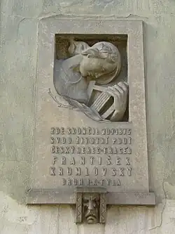 Pamětní deska Františkovi Krumlovskému na budově bývalého kláštera Milosrdných bratří ve Svatoplukově ulici v Prostějově. Deska byla odhalena 29. prosince 1940.