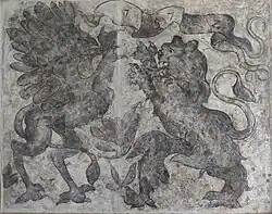 Souboj gryfa se lvem, transfer sgrafita z domu č.p. 144 v dnešní Neumannově ulici. Nápisová páska s letopočtem 1572.