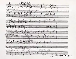 Ukázka Händelova rukopisu, originální ruční partitury, 4 takty a deset notových linek pod sebou