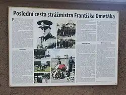 Informační tabulka na hřbitovní zdi v Mutějovicích