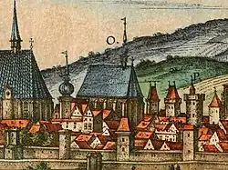 Bývalý herburský klášter s kostelem (písmeno O) na vedutě z roku 1617