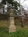 Kamenné Žehrovice, socha Panny Marie Bolestné proti vchodu na hřbitov.jpg