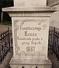 Nápis na kříži z 19. století v Bogucicích, městské části Katovic: „Fundátoři tohoto kříže / Majitelé pozemku z obce Bogucice“.