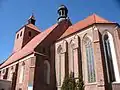 Kostel sv. Mikuláše v Grudziadzu; k jednolodnímu chrámu je přistavěna pseudobazilika