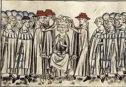 Iluminace, v jejímž prostředku stojí tři kardinálové, kteří společně pokládají korunu na hlavu muži, jenž sedí mezi nimi. Kolem nich je z obou stran shromážděno mnoho diváků, a to zejména vojáků.