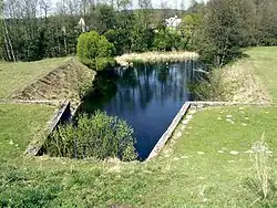 Verseka u přehrady hydroelektrárny u obce Krūminiai