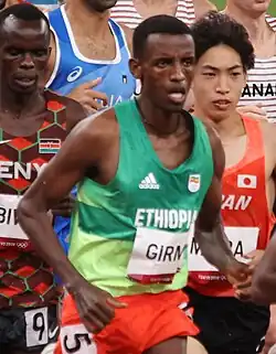 Muži – Lamecha Girma 7:52,11 min. Ano