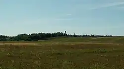 Údolí řeky Kulšė mezi městečkem Laukžemė a vsí Sūdėnai