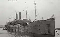 Americká loď SS America - ve své době třetí největší loď na světě, která v roce 1920 přepravila 22. transport s 6,5 tisíci lidmi pod velením pplk. Josefa Kroutila