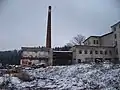 Zbořená část továrny