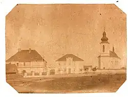 Farní kostel Nejsvětější Trojice v Malšicích na fotografii z roku 1875.