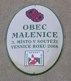 Tabule poukazující na úspěch v anketě Vesnice roku