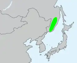 Místo původu mikrobioty křížolisté