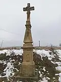 Pískovcový kříž na jihozápadním okraji obce