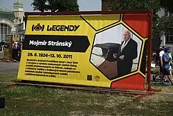 Plakát Mojmíra Stránského na výstavě Legendy 2018 v Praze.
