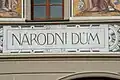 Národní dům, detail sgrafitové výzdoby domu: nápis