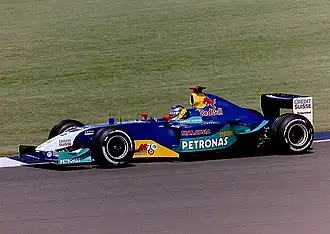 Nick Heidfeld řídící vůz C22 při Grand Prix Velké Británie 2003.