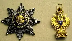 Řádová hvězda a odznak (revers)