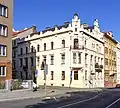 1899 Nájemní dům „U sv. Jiří“, Praha 7-Holešovice, čp. 675, Kamenická 2, nároží Kamenické a Kostelní ulice.