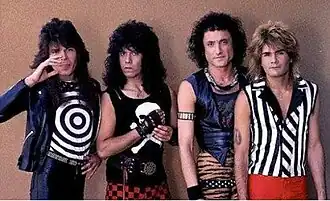 Sestava kapely z éry Metal Health v roce 1984: (zleva) Rudy Sarzo (baskytara), Frankie Banali (bicí), Kevin DuBrow (zpěv) a Carlos Cavazo (kytara).