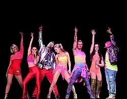 S Club 7 v roce 2015, zleva O'Meara, Stevens, Cattermole, Spearritt, Lee, Barrett a McIntosh