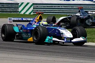 Giancarlo Fisichella řídící vůz C23 při Grand Prix USA 2004.