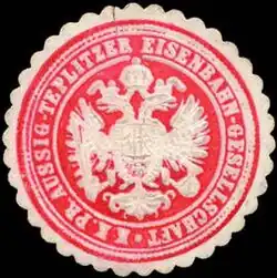 Historická pečeť společnosti ATE – červená s dvojitou orlicí ve znaku.