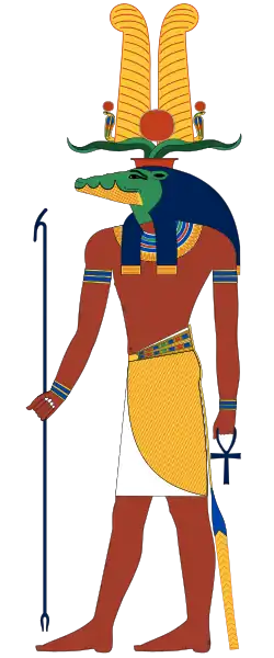 Sobek v podobě muže s krokodýlí hlavou s korunou složenou z beraních rohů, slunečního kotouče a dvou vysokých per