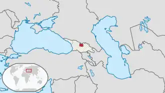Poloha Jižní Osetie (červeně) v oblasti na území Gruzie (světle šedě)