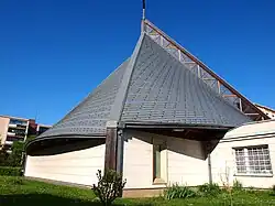 Římskokatolický farní kostel Neposkvrněného početí Panny Marie z roku 1994, vpravo od něj fara z roku 1930, která více než 60 let sloužila jako kaple