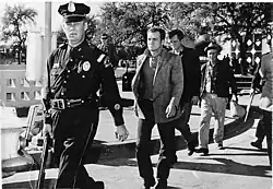 Fotografie tzv. tří trampů pořízená těsně po jejich zadržení