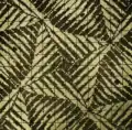 Kosočtverečné vzory tkané na stínovém kepru