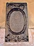 Náhrobní kámen Justiny Ondruškové z Počátek (z roku 1707), jižní zeď kostela sv. Petra a Pavla