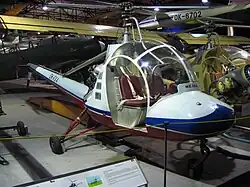 V bruselském stylu se nesly, a to doslova, i některé další dopravní prostředky, jako lehký, cvičný a spojovací vrtulník pro dvoučlennou posádku HC-2 Heli Baby; na obrázku je jeho modernizovaná verze HC-102; prototyp vrtulníku byl rovněž součástí světové výstavy EXPO 58