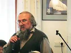 Petr Kužvart dne 12. října 2013 v hotelu Atlantida v Živohošti na veřejné schůzi proti hrozící těžbě zlata v Mokrsku